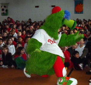The Phillie Phanatic demonstrates some of his dance moves during an assembly at Friendship Elementary School.
