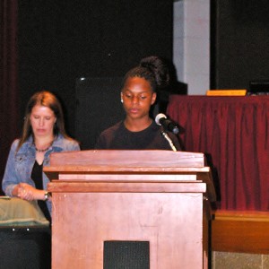 South Brandywine student Ianni Thompson-White reads her poem for the school board on Tuesday night.