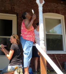Jennifer Kasitz (left) and Susan A. Jones work on priming Jones' front porch.