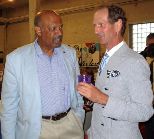 Chester County Commissioner Terence Farrell (left) chats with Don Cochran, president of the Delaware Valley Point-to-Point Association and owner of the warehouse, which served as the venue for the DVA's annual awards party.