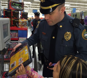 Coatesville Cpl. Jonathan Shave offers assistance to his shopper at the price-checker.