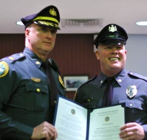 Police Chief Jack Laufer (left) stands with Ofc. Joseph Thompson (right) after Thompson's swearing in ceremony.