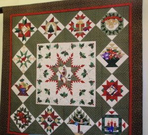 The Christmas-themed quilt was the first in a series of four large quilts plus eight small panels to be completed by the volunteer group.
