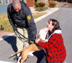 With Chester County SPCA Animal Protective Services Officer Craig Baxter holding his leash, Radar is reunited with Cheryl Shaw, a former SPCA officer, who traveled from West Virginia for the sendoff.