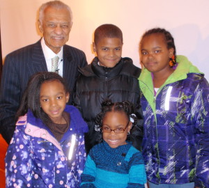 Dr. C.T. Vivian (from top left, clockwise) appears with some of the younger members of the audience: Breon Lopp, Amina Lawson, Taylar Pulliam, and Maia Lawson.