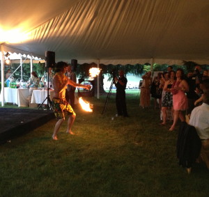 A fire dancer adds to the Hawaiian atmosphere at the Brandywine Health Foundation's 2013 Garden Party.