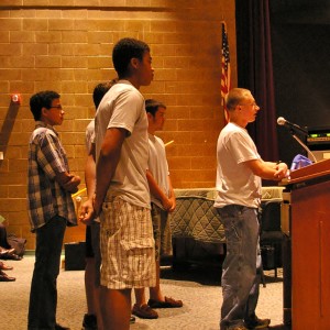 With his ROTC compatriots behind him, Chasan Hall asks the school board for a letter of support. "This program offered me insane opportunities that I would never have dreamed about in middle school," he said.