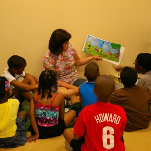 Reeceville teacher Terry Valentine reads to students at the BOYS and G3 summer reading program. Valentine created a curriculum that incorporated reading, biology, and art.