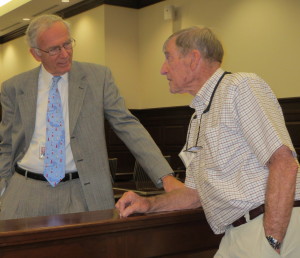 Chester County Court Senior Judge Thomas G. Gavin (left) chats with Ned Shenton, the son of the creator of a mural depicting county history that was painstakingly removed from a plaster wall of the historic courthouse before it was sold a couple of years ago.