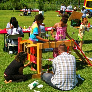 Festival attendees turn recycled goods into art. The day festival was full of activities for children.