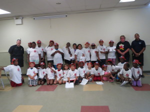 Participants in Coatesville's "Fire Safety Day Camp" show off their hats and t-shirts.