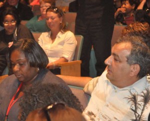 Coatesville Area School District Information Technology Abdallah Hawa and CASD Director of Middle School Education Teresa Powell look on during Tuesday night's Board of Education meeting.