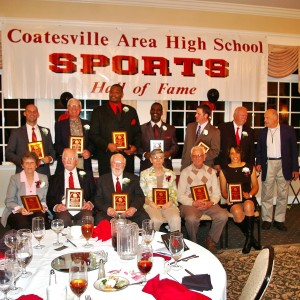 Inductees display their plaques.