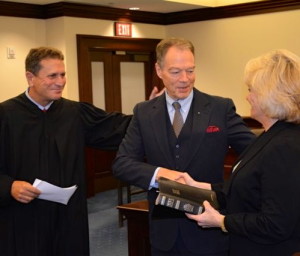 Chester County Court Judge Anthony A. Sarcione (from left) congratulates c and Sheriff Carolyn “Bunny” Welsh, who held the Bible during March’s swearing-in.