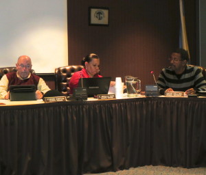 Coatesville City Council Members Ed Simpson (from left), C. Arvilla Hunt, and David C. Collins discuss landlord fees during Tuesday night's City Council meeting.