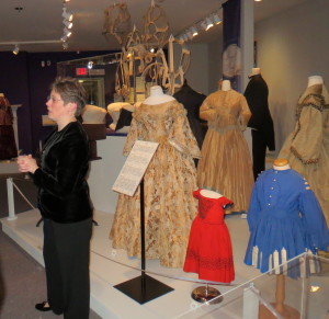 Ellen Endslow, co-curator of the fashion exhibit, discusses the Civil War influence, such as military-style embellishments, on some of the clothing worn in the 1870s.
