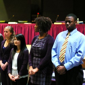  Nicolina Sciarretta (from left), Johnna Morales, Gabrielle Hines, and Joshua Mensah stand before the audience as Mr. Fisher recognizes them as some of the top students in their class.
