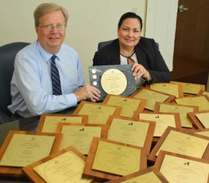 Mark Rupsis, Chester County Chief Operating Officer, and Julie Bookheimer, Chester County Finance Director, with the latest in the collection of Government Finance Officers Association Distinguished Budget Presentation Awards that the County has earned consecutively over the past 25 years.